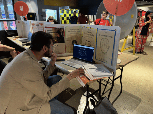 A young person working at a computer at a Coolest Projects event.