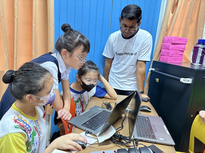 Young learners in the classroom using Experience AI resources in Malaysia