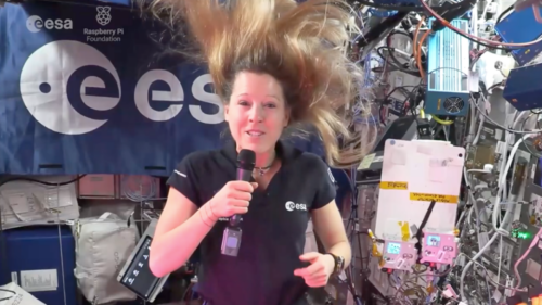 An astronaut operating the Astro Pi computer inside the International Space Station.