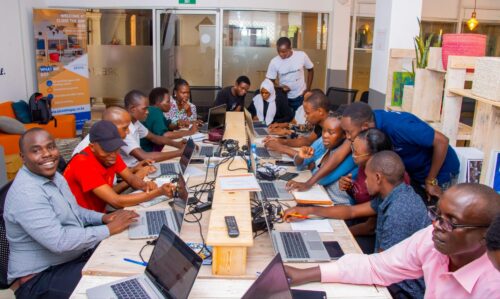 Photo of a group of educators being trained to teach and use Experience AI resources.