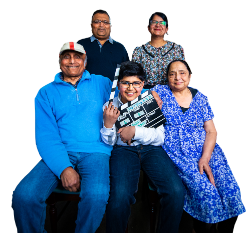 Two children sat smiling