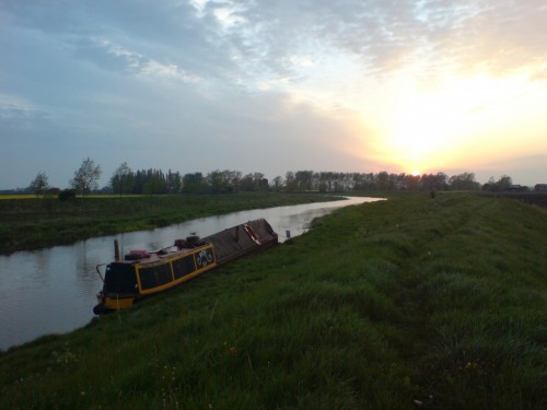 Narrowboat Roe moored on the Old West at sunset