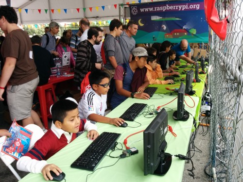 Attendees using Raspberry Pis to program animations onto the new Sense HAT.