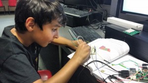 kid with breadboard