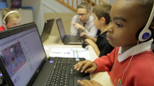 A child absorbed in a task at a Code Club