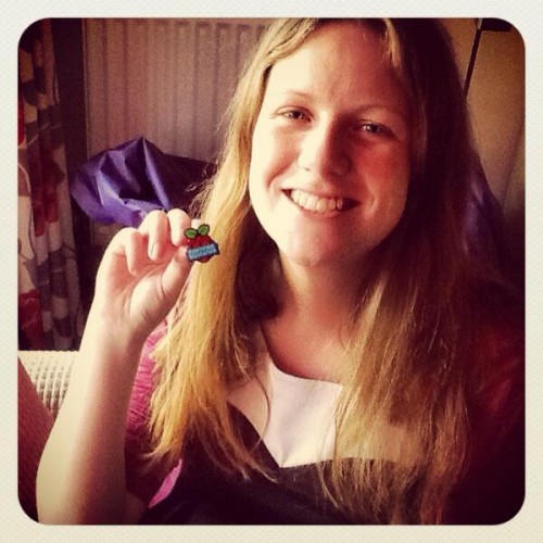 Sway Grantham holding her Raspberry Pi Certified Educator badge