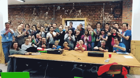 An animated gif: a group of new Raspberry Pi Certified Educators celebrate by pulling party poppers